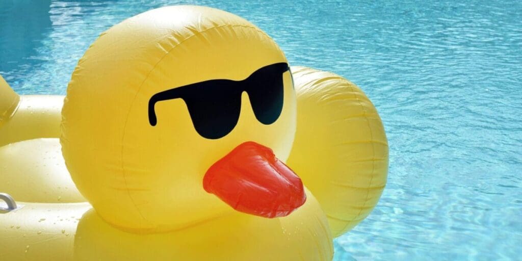 Yellow Inflatable Pool Ducky Float - Floating in Swimming Pool